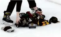  ?? DANIELLE PARHIZKARA­N/GLOBE STAFF ?? . . . then the TD Garden crowd made sure a cleanup crew was needed for the headwear.