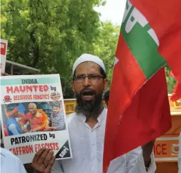  ?? — BIPLAB BANERJEE ?? A member of Social Democratic Party of India protests in New Delhi on Thursday against the assault on social activist Swami Agnivesh allegedly by Bharatiya Janta Yuva Morcha members.