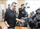  ?? DENIS TYRIN/AP ?? Opposition leader Alexei Navalny speaks in court Monday before the court handed down a 15-day jail sentence.