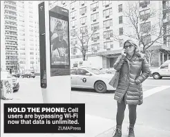  ?? ZUMAPress ?? HOLD THE PHONE: Cell users are bypassing Wi-Fi now that data is unlimited.