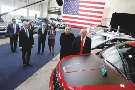  ?? Reuters ?? US President Donald Trump tours new cars with auto industry leaders, including Fiat Chrysler CEO Sergio Marchionne, at the American Center for Mobility, a test facility for driverless car technology, in Ypsilanti Township, Michigan.