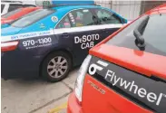  ?? Paul Chinn / The Chronicle ?? Flywheel Taxi, formerly DeSoto Cab, claims the PUC should not regulate ride service companies.