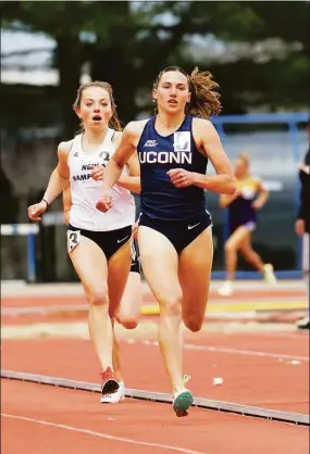  ?? UConn Athletics / Contribute­d photo ?? Mia Nahom broke the school record in the women’s 5000 meters with a time of 16 minutes, 35 seconds at the Virginia Challenge in April.