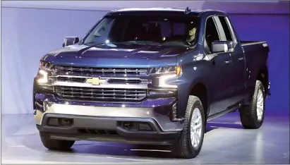  ?? Associated Press photos ?? The 2019 Chevrolet Silverado High Country pickup is unveiled, Saturday in Detroit.