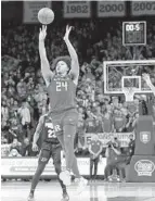  ?? NOAH K. MURRAY AP ?? Rutgers forward Ron Harper Jr. hits the winning shot against Purdue on Thursday, the program’s first win over a No. 1 team.