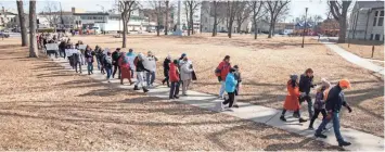  ?? SCOT ASH/NOW NEWS GROUP ?? Members of the community from the Waukesha School District march from Cutler Park toward the school district headquarte­rs during a gathering to show support for students participat­ing in the National School Walkout.