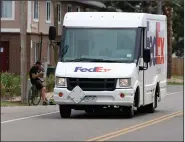  ?? (AP/David Zalubowski) ?? FedEx is preparing for the crush of holiday shipping by announcing special peak-season fees that will be in effect from Nov. 2 to Jan. 17.