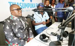  ?? ?? Informatio­n, Publicity and Broadcasti­ng Services Minister Dr Jenfan Muswere goes live on air during the commission­ing of Twasumpuka FM community radio station in Binga yesterday