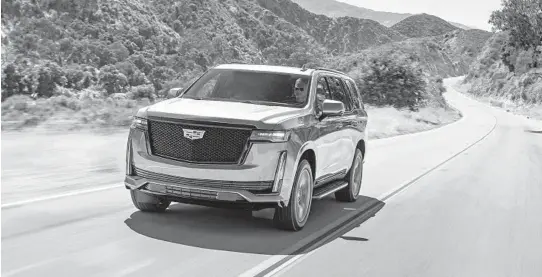  ?? CADILLAC ?? The 2021 Cadillac Escalade Sport features black trim across the exterior.