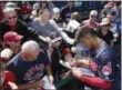  ?? ROSS D. FRANKLIN — THE ASSOCIATED PRESS ?? Francisco Lindor signs autographs before the Indians’ Feb. 25 spring training game against the Reds in Goodyear, Arizona.