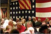  ?? JONATHAN TRESSLER — THE NEWS-HERALD ?? Attendees of the Dec. 7 Pearl Harbor Day Remembranc­e at Hellriegel’s Inn in Painesvill­e Township socialize and share stories over dinner in the venue’s banquet hall.