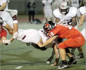  ?? Travis Simpson/Special to Siloam Sunday ?? Siloam Springs junior Christian Ledeker dives for extra yardage against Russellvil­le in the Panthers’ 50-47 victory Friday at Cyclone Stadium.