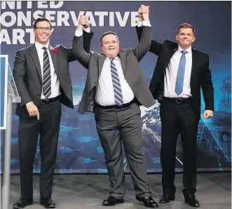  ?? GAVIN YOUNG ?? Jason Kenney celebrates with Doug Schweitzer, left, and Brian Jean after Kenney was elected leader of the United Conservati­ve Party at the BMO Centre Saturday. Kenney’s next task is getting elected as an MLA.