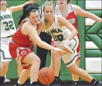  ?? Staff photo/ Jake Dowling ?? New Knoxville’s Ellie Gabel tips the ball away and eventually steals it from Anna’s Ella Doseck ( 20) during the third quarter of a non- conference girls basketball game on Saturday at Anna High School. The Rangers beat the Rockets 38-26.