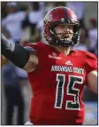  ?? Arkansas Democrat-Gazette/ MITCHELL PE MASILUN ?? Quarterbac­k Justice Hansen leads Arkansas State University against Nevada on Dec. 29 in the Arizona Bowl, which was ranked by one writer as this year’s 30th most watchable bowl game.