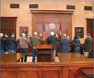  ?? (Caitlan Butler/News-Times) ?? Union County Justices of the Peace swear their oaths of office before Judge Mary Thomason on Friday, Jan. 1.