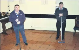  ?? (Pic: John Ahern) ?? FLOOD DAMAGE: Cllr. Noel McCarthy, helping publican, Richie Flynn with the clean up following flood damage to The Avondhu Bar in Fermoy on Wednesday - ‘a malfunctio­n’ at the pumping station on Rathealy Road was blamed.