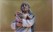  ?? PICTURE: ASSOCIATED PRESS ?? A statue of Mother Teresa is illuminate­d at the entrance of St Thomas Church on the eve of her canonisati­on, in Kolkata, India, on Saturday.