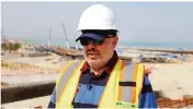  ??  ?? Ahmad Al-Hassan, assistant undersecre­tary for road engineerin­g at the public works ministry talks to reporters at the constructi­on site of the Jaber Causeway.