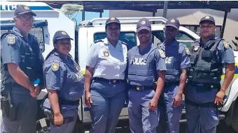  ??  ?? The KwaNonqaba Crime Prevention Unit, led by Warrant Officer JC Brink, left, with the commanding officer of the police station, Lieut-Col Madongwana, third from left.