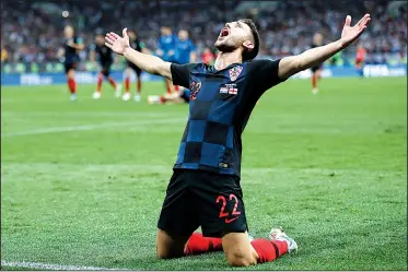  ?? AP/FRANK AUGSTEIN ?? celebrates after Wednesday’s 2-1 extra-time victory over England on Wednesday in the World Cup semifinals at Moscow. Croatia will face France in the championsh­ip game Sunday.