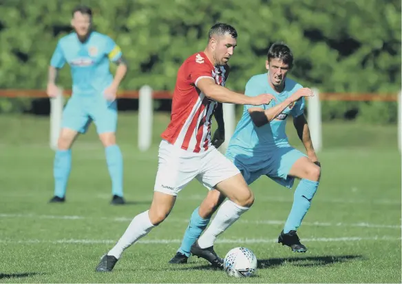  ??  ?? Seaham Red Star and Ryhope CW, in blue, shared the spoils with a 1-1 draw in their Northern League Division One clash at Seaham Town Park on Saturday. Picture: Tim Richardson