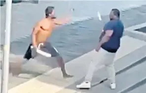  ?? ?? Ernesto Elliott (right) attacking Nathaniel Eyewu-ago in south London after his deportatio­n flight was blocked. Celebritie­s and Labour MPS have challenged the repatriati­on flights