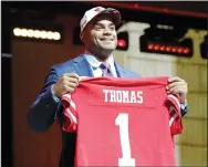  ?? YONG KIM/TRIBUNE NEWS SERVICE ?? Defensive end Solomon Thomas on stage after the San Fransisco 49ers selected him with the third overall pick during the NFL Draft in Philadelph­ia on Thursday.