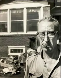  ?? MEDIANEWSG­ROUP FILE PHOTO ?? George Jones, of 1018Sycamo­re Street, Chester, takes a break from cleaning his home in the days following the flood. Jones spent the night of the flood on the roof of his home to escape the water.