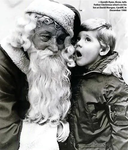  ?? ?? > Gareth Ryan, three, tells Father Christmas what’s on his list at David Morgan, Cardiff, in December 1980