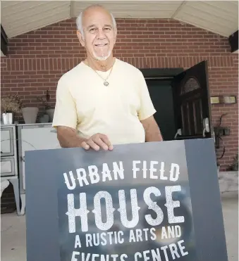  ?? DAX MELMER ?? Jim Ghanam holds a sign Thursday at the Urban Field House, the former St. William Church in Emeryville. The Next Generation Leahy group along with Crystal Gage and Dave Mason will perform there Friday and Saturday nights.