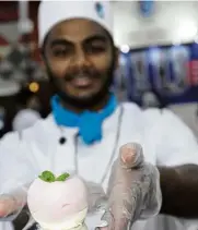  ??  ?? Quest Internatio­nal University Perak’s School of Hospitalit­y student Marakrishn­an Pandian, showing a mix berry mousse at the fair.