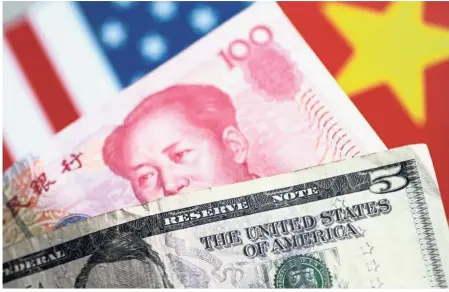  ?? — Reuters ?? Bumpy ride: It’s been a roller coaster for the yuan this year: the currency surged 2.6% in January on the back of a sliding dollar and then gave up about half those gains in just two sessions.