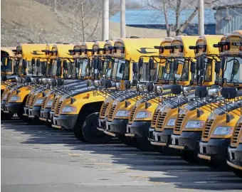  ?? STUART CAHILL / HERALD STAFF FILE ?? READY OR NOT: Part of the Boston Public Schools bus fleet is seen in Dorchester.