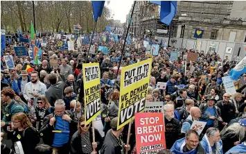  ??  ?? Demonstrat­ors crowd the streets during a Peoples Vote anti-Brexit march in London.