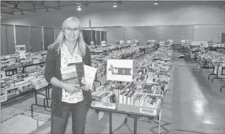  ?? JOURNAL PIONEER FILE PHOTO ?? Anna MacDonald, the volunteer co-ordinator for the Journal Pioneer/Rotary Club of Summerside book sale. In 2017, the book sale brought in a total of $12,120 for local literacy programs.