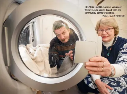  ?? Picture: GLENN FERGUSON ?? HELPING HANDS: Lazarus volunteer Wendy Leigh assists David with the community centre’s facilities.