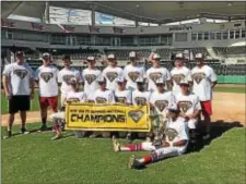  ??  ?? The Pennsylvan­ia Playmakers pose with the trophy after winning the title in Fort Myers, Fla. The team is made up mostly from Chester County, but is led on the mound by Garnet Valley’s Jack Haveson.