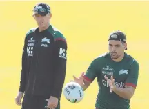  ??  ?? Rabbitohs coach Wayne Bennett watches as Cody Walker catches a pass at a training session. Picture: Getty Images