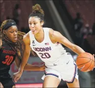  ?? David J. Phillip / Associated Press ?? UConn’s Olivia Nelson-Ododa against Houston’s Tatyana Hill during a game in February.