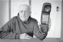  ?? Robert F. Bukaty / Associated Press ?? Peter Froehlich depends on a landline telephone because he lives in a wireless dead zone. He’s concerned about a new Maine law that phases out the requiremen­t for telephone companies to provide landline service.