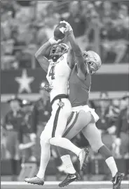  ?? NWA Democrat-Gazette/BEN GOFF ?? Texas A&M receiver Damion Ratley (4) hauls in a pass while Arkansas cornerback Kamren Curl defends Saturday in Arlington, Texas.