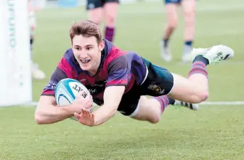  ?? ?? Greg Smith dives over to score one of Maidenhead's nine tries. Photo: Paul Morgan.