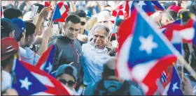  ?? AP/CHARLES REX ARBOGAST ?? Puerto Rican nationalis­t Oscar Lopez Rivera (center) arrives May 18 for a gathering in his honor in Chicago’s Humboldt Park neighborho­od.