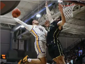  ?? PHOTOS BY SHAE HAMMOND — STAFF PHOTOGRAPH­ER ?? Archbishop Riordan's Kaia Berridge, left, dunks the ball against Archbishop Mitty's Aaron Biebel in the second half of Friday's Central Coast Section Open Division championsh­ip game at Leavey Center at Santa Clara University.