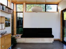  ??  ?? 2— Clerestory windows funnel additional natural light without compromisi­ng privacy. The sideboard is by Michael Draper. The painting below the book shelf is by John Horner. 3— Built-in furniture frees up circulatio­n in the living area. The pendant is by Isamu Noguchi. 4— Stairs lead to the entry platform and into the kitchen and living area.