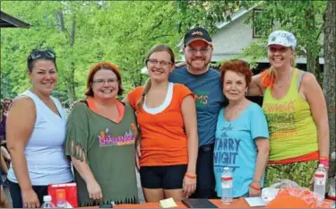  ?? News-herald photos — DEBBY HIGH ?? Robbie Peuplie, who has been diagnosed with MS, stands withe many of his supporters during the Zumba fundraiser. Pictured are, from left, Lindsey Calomino; his sister, Heather Sinsel, his girlfriend, Julie Watson; his mother, Jame Peuplie; and Zumba...