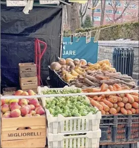  ?? Katie Workman / AP ?? Carrots, parsnips and other root vegetables, at right, are among vegetables at the Union Square Farmers Market in New York recently.