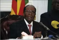  ?? THE ASSOCIATED PRESS ?? Zimbabwe President Robert Mugabe delivers his speech during a live broadcast at State House in Harare on Sunday.