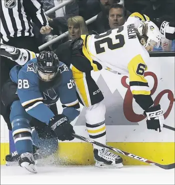  ?? Jeff Chiu/Associated Press ?? Carl Hagelin, right, manages to get past San Jose’s Brent Burns Saturday night in San Jose, Calif.